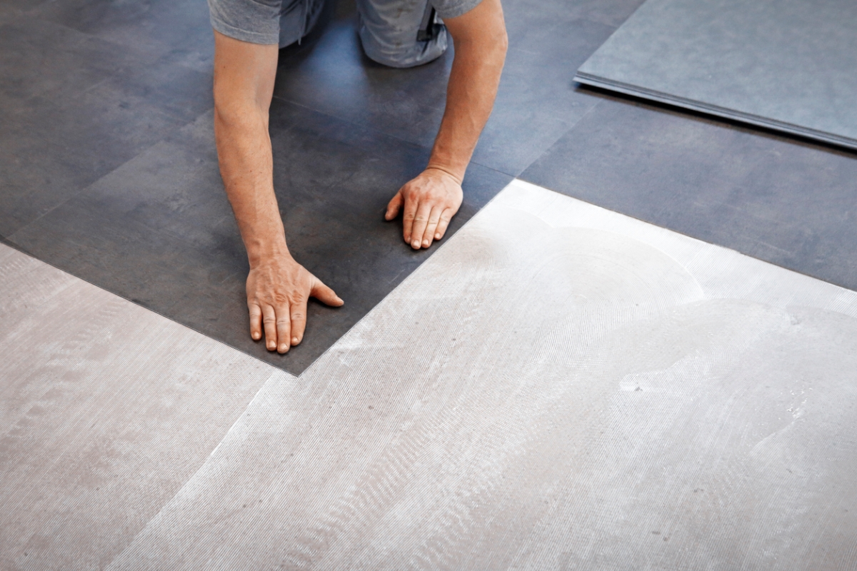 Person installing flooring