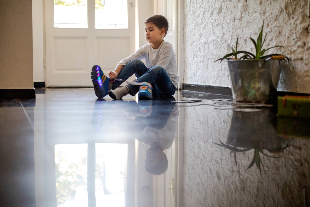 Kid putting on shoes