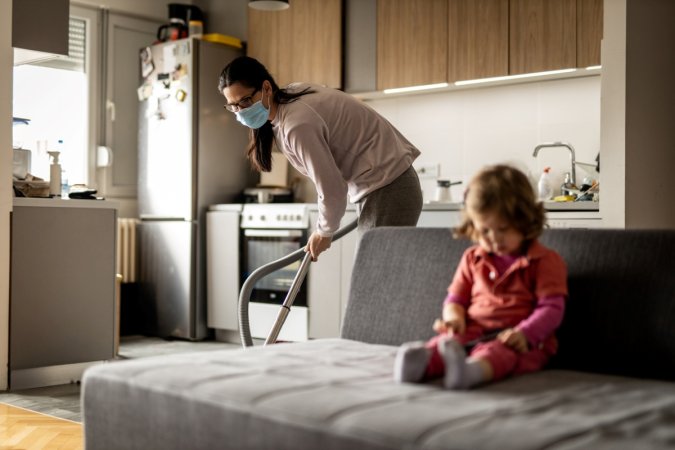 Mom cleaning with mask on