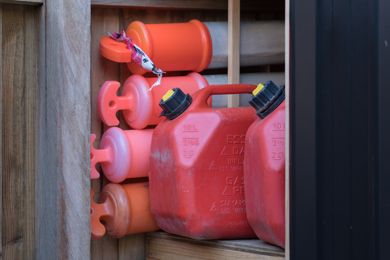 red gasoline cans stored in garage