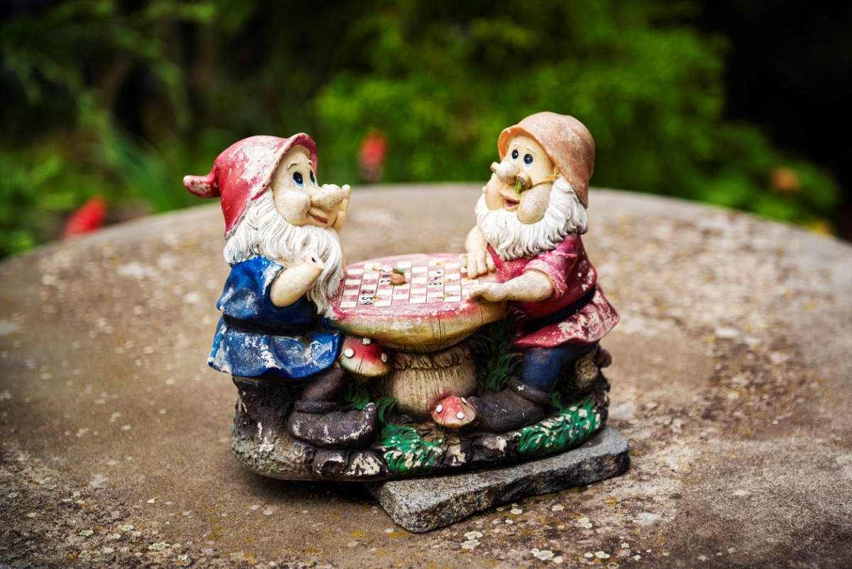 Garden gnome on concrete lid