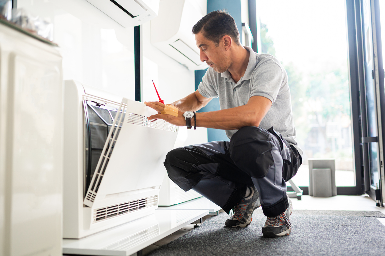 technician working on air conditioner