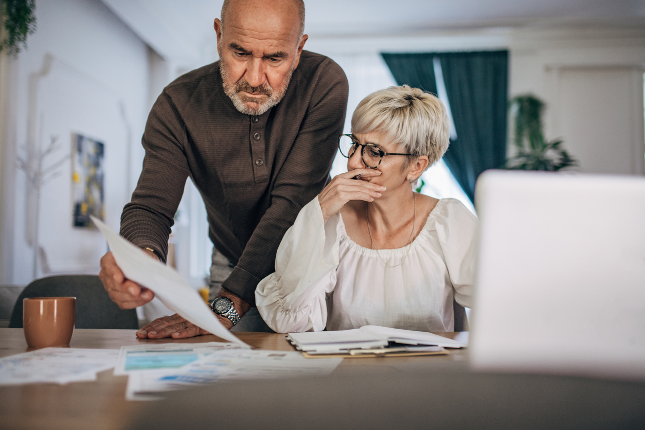 couple at computer looking at bills together