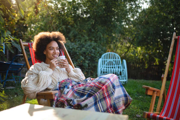 Young woman enjoying time in her backyard