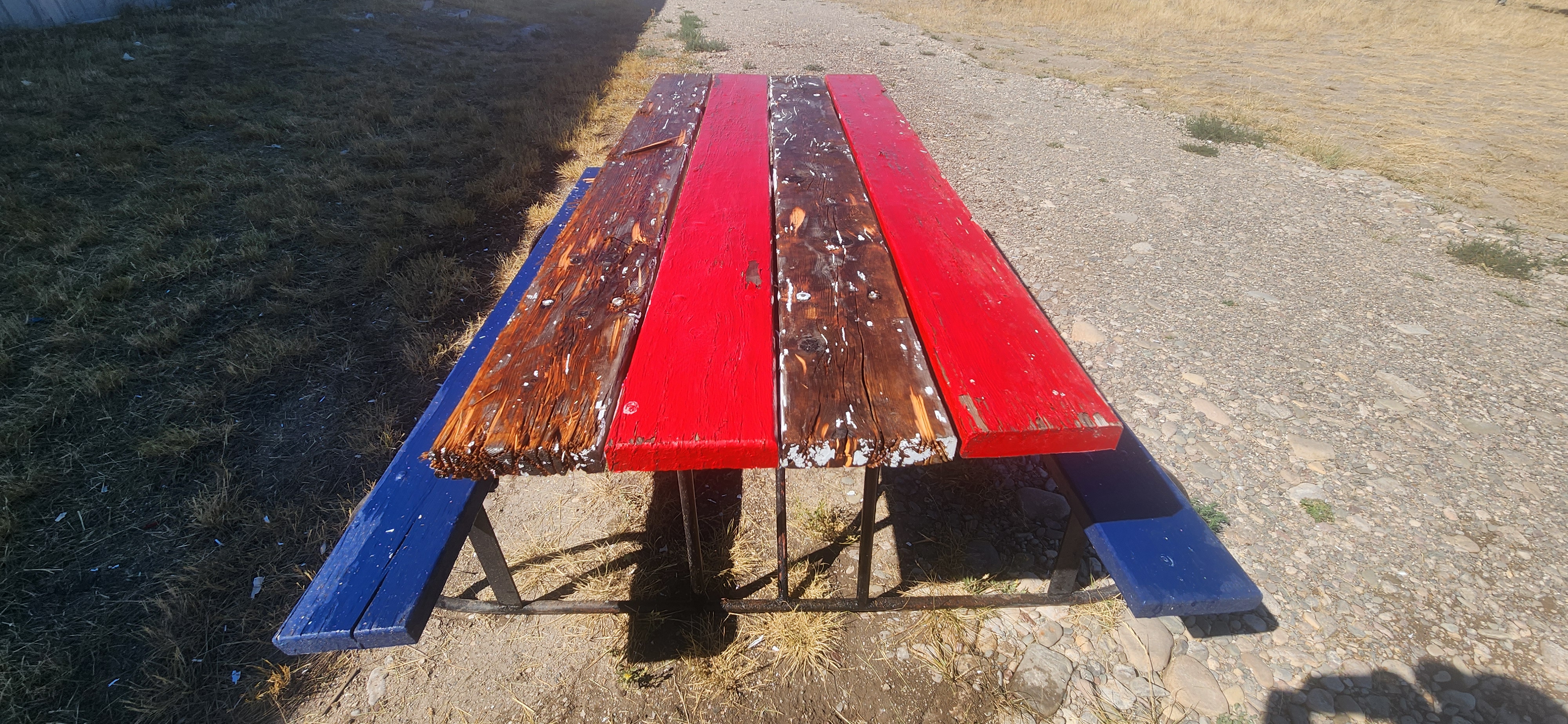 Photo of a picnic table after it was pressure washed