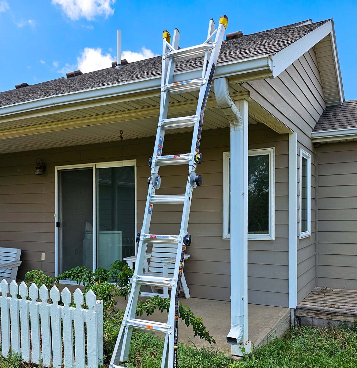 The Gorilla GLMPXA-22 ladder set up as an extension ladder reaching up to a roof