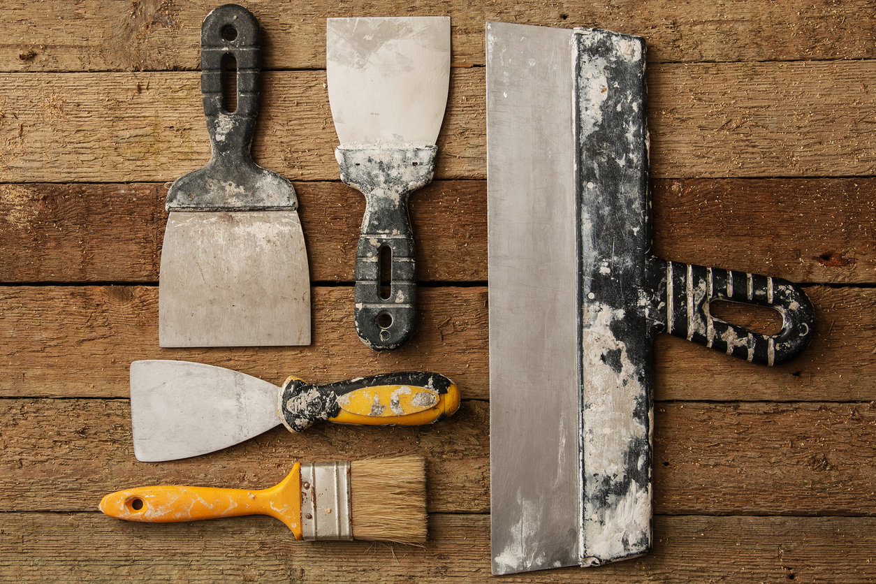 overhead of painting tools on wood surface