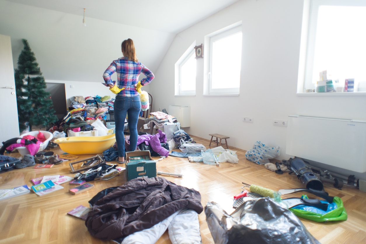 Young housewife preparing for cleaning clutter at home.