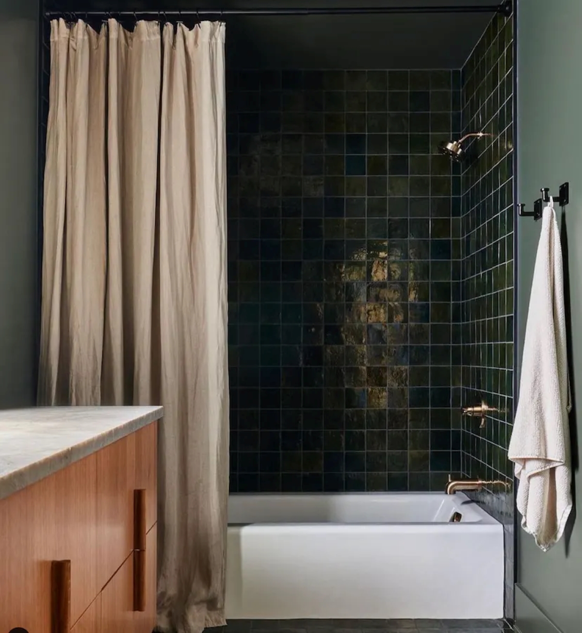 Dark green bathroom with green tiles