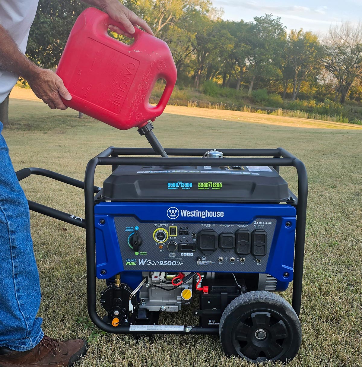 Person pouring gas into a Westinghouse WGen9500DF Generator.