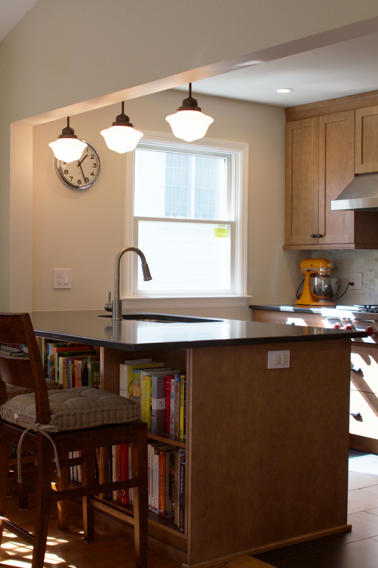 Kitchen island with cookbook storage