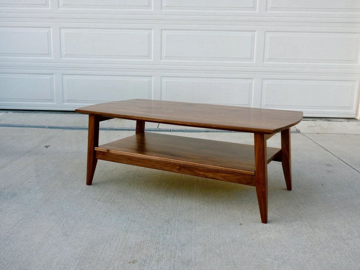 Class curved edged wooden table.