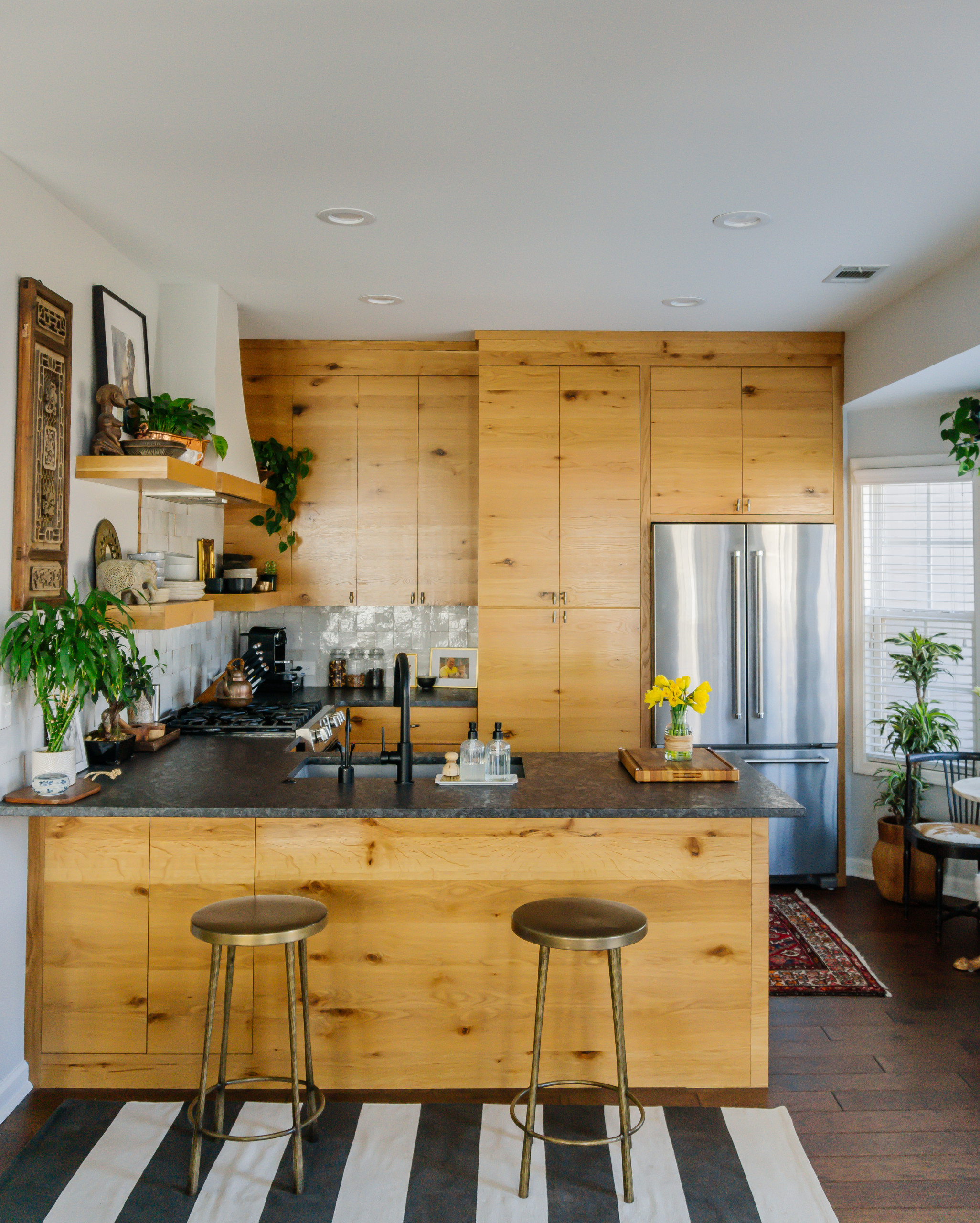 Kitchen with floating shelves and cupboards