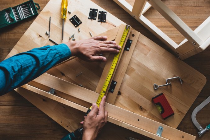 Man assembling table.