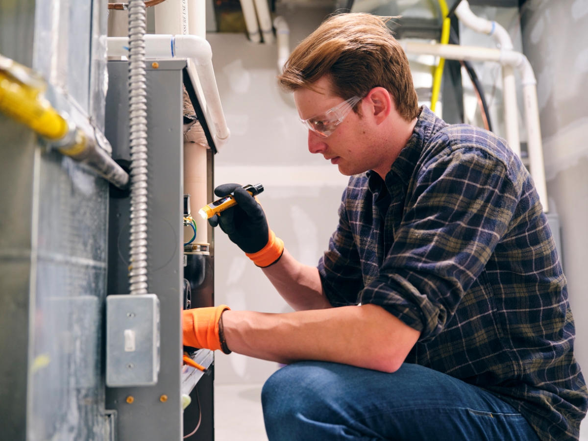 Person fixing furnace