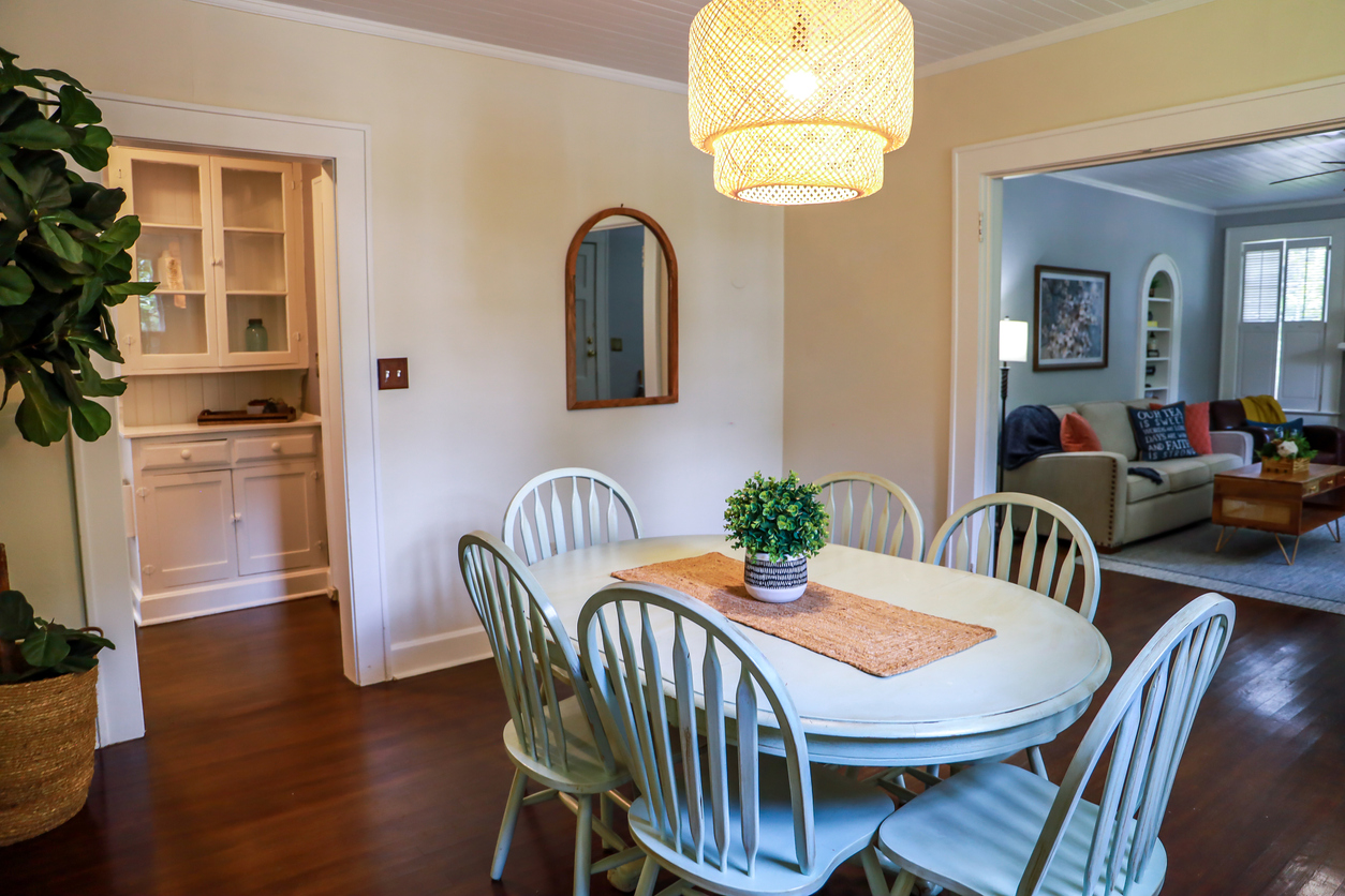 view of dining room separated from living room and kitchen