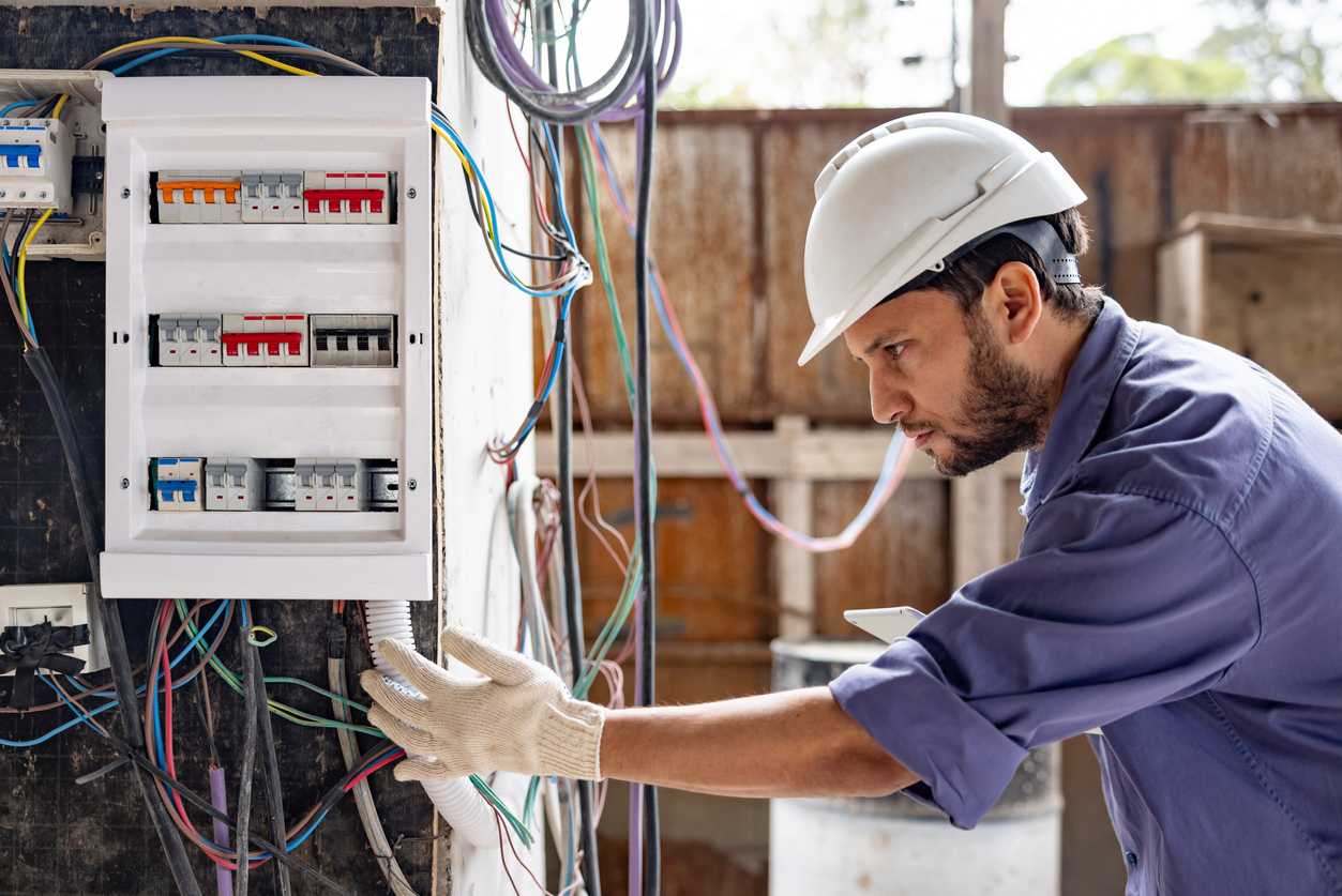 Electrician working on a switchboard.