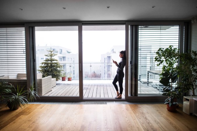 Woman standing in open door.