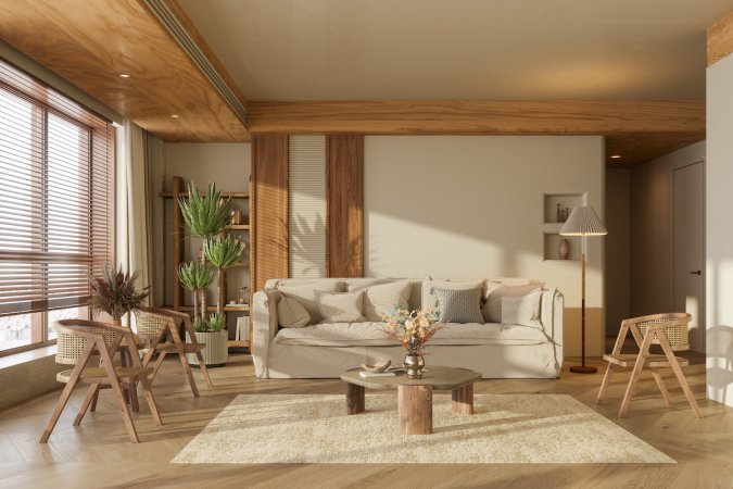 Japandi interior design living room: This Wabi-sabi living room in natural colors with wicker chairs, potted plant and a parquet floor.