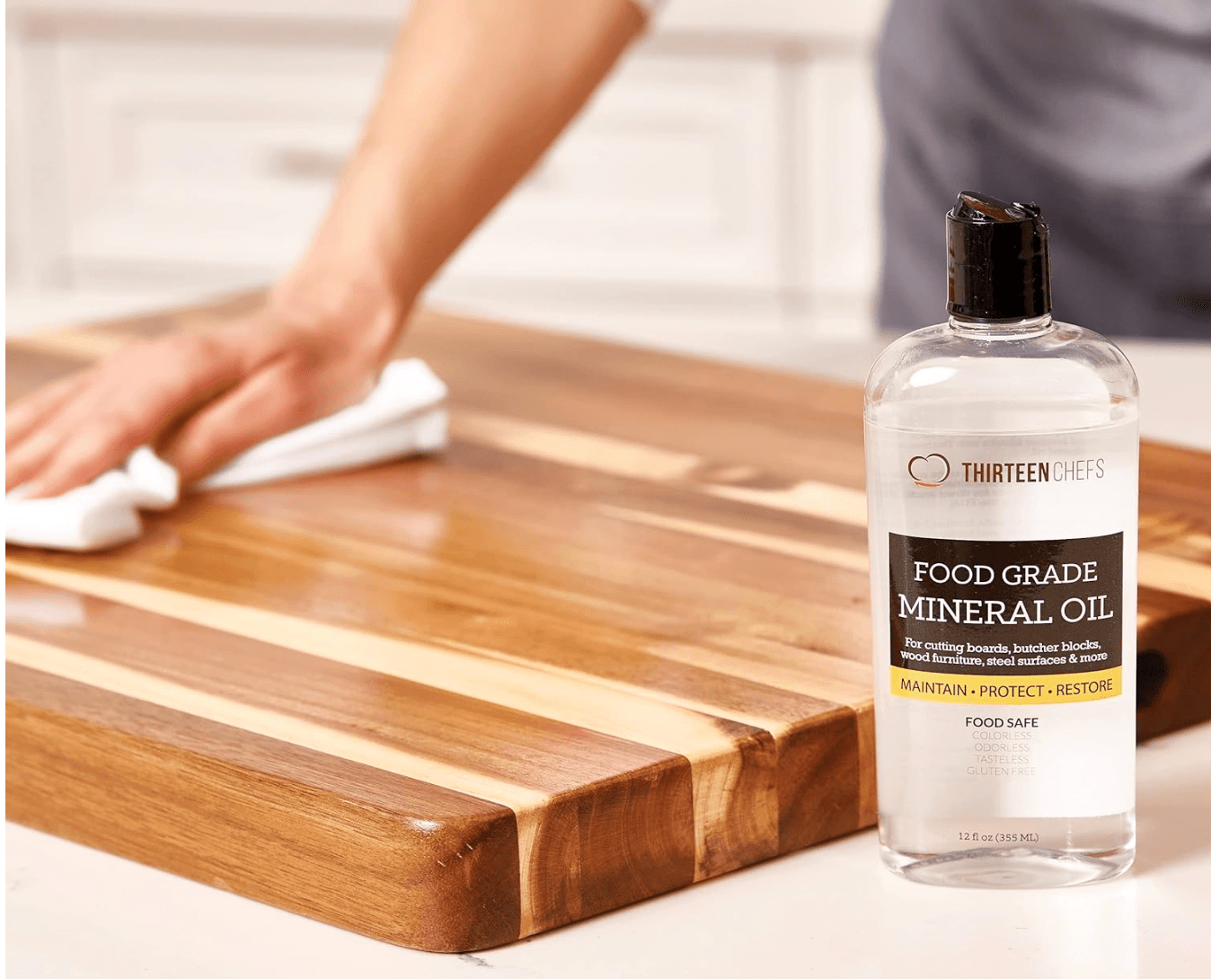 Using a conditioning oil on a wooden butcher block. 