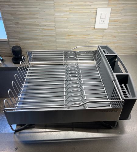 The KitchenAid full-size dish-drying rack on a kitchen counter next to a kitchen sink.