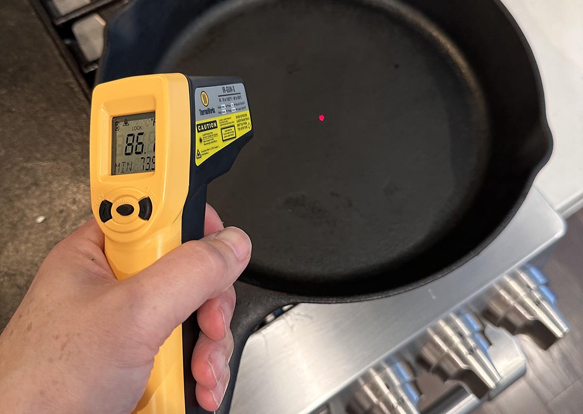 Red laser dot from IR gun on cast iron skillet