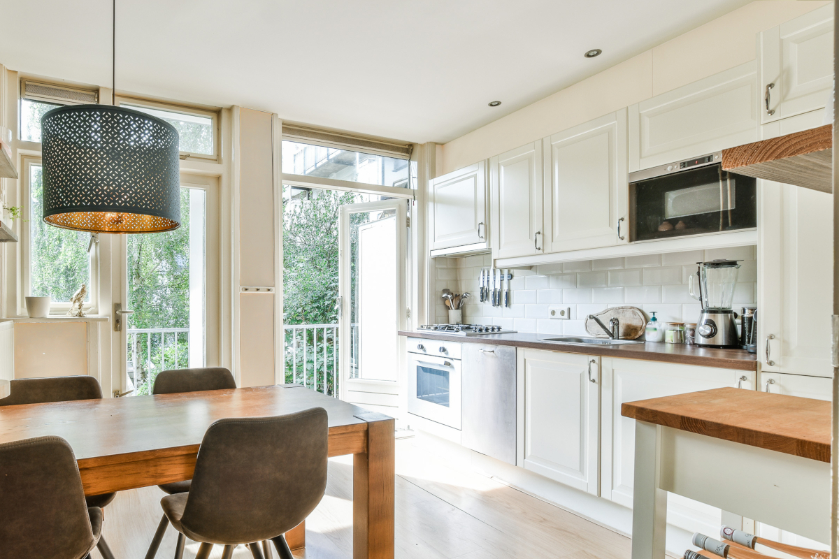 Beige wall paint in a small kitchen and dining room.