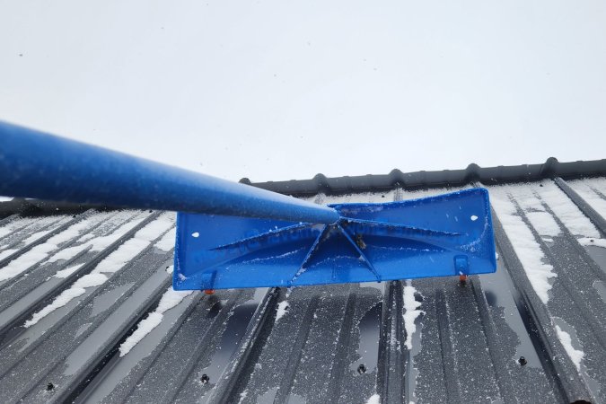 The Avalanche! Roof Rake undergoing testing pulling light snow off a metal roof.