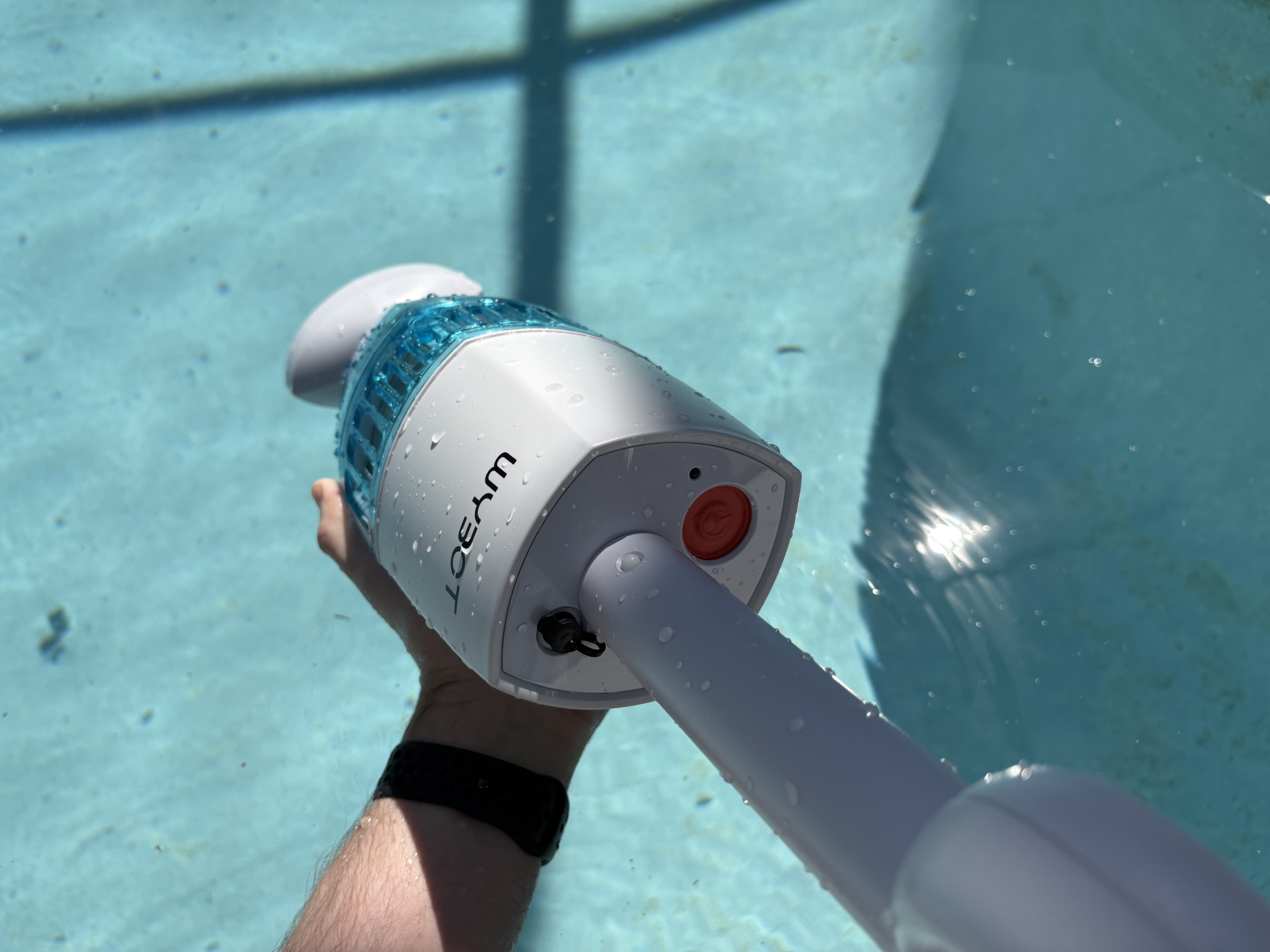 a person using Wybot Handheld Pool Vacuum 