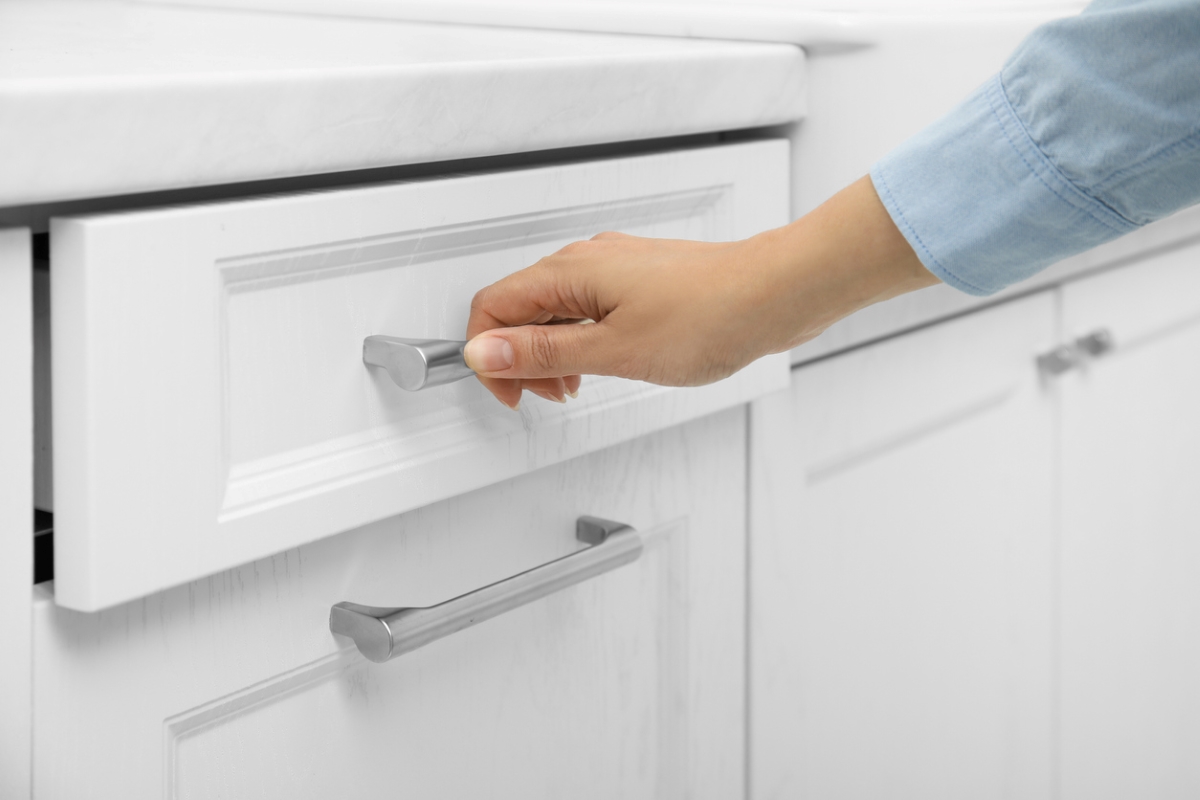 Person opening drawer.