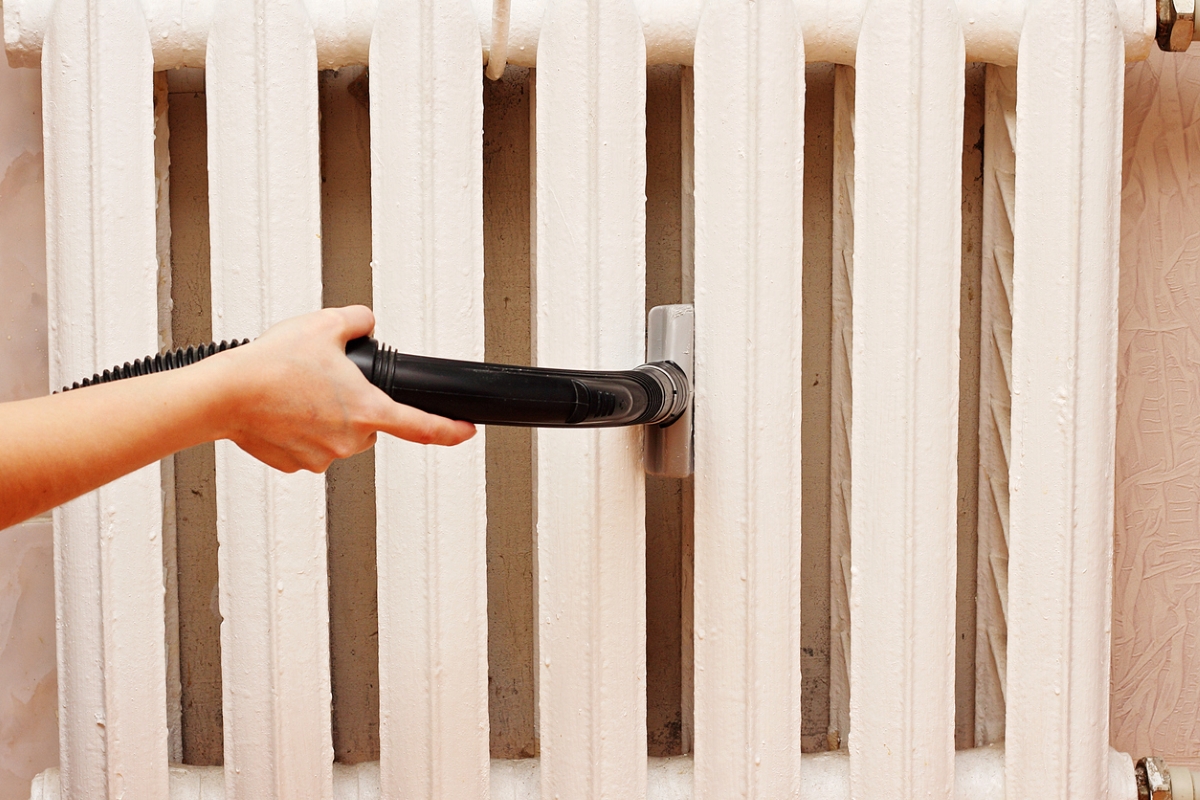 Vacuuming radiator.