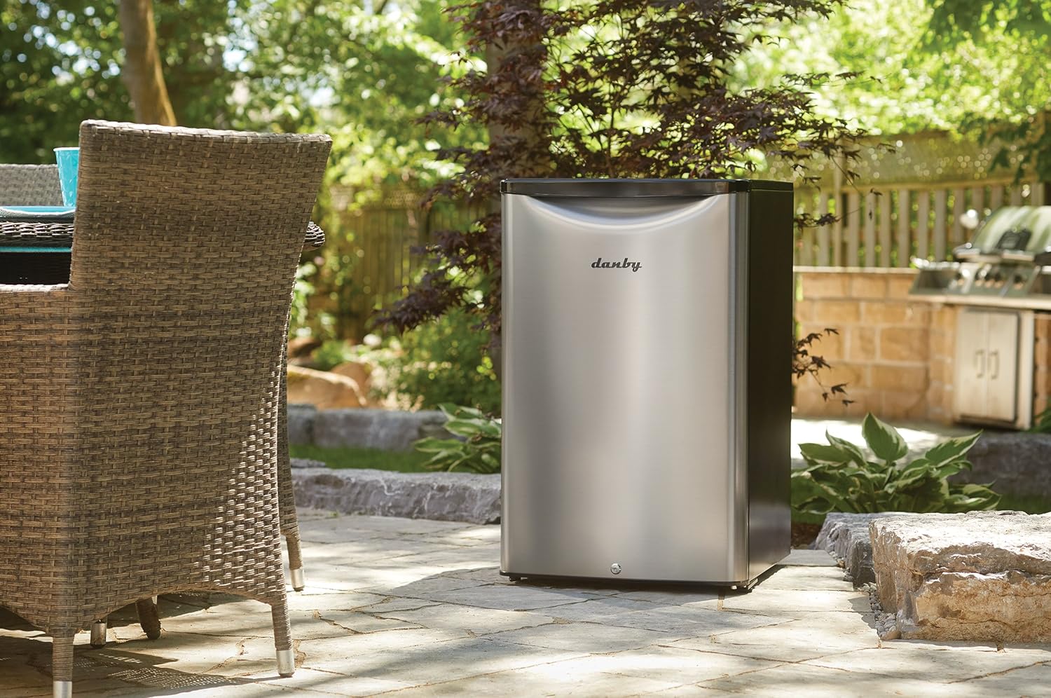 The Danby 4.4 Cu. Ft. Outdoor Fridge on an outdoor patio.