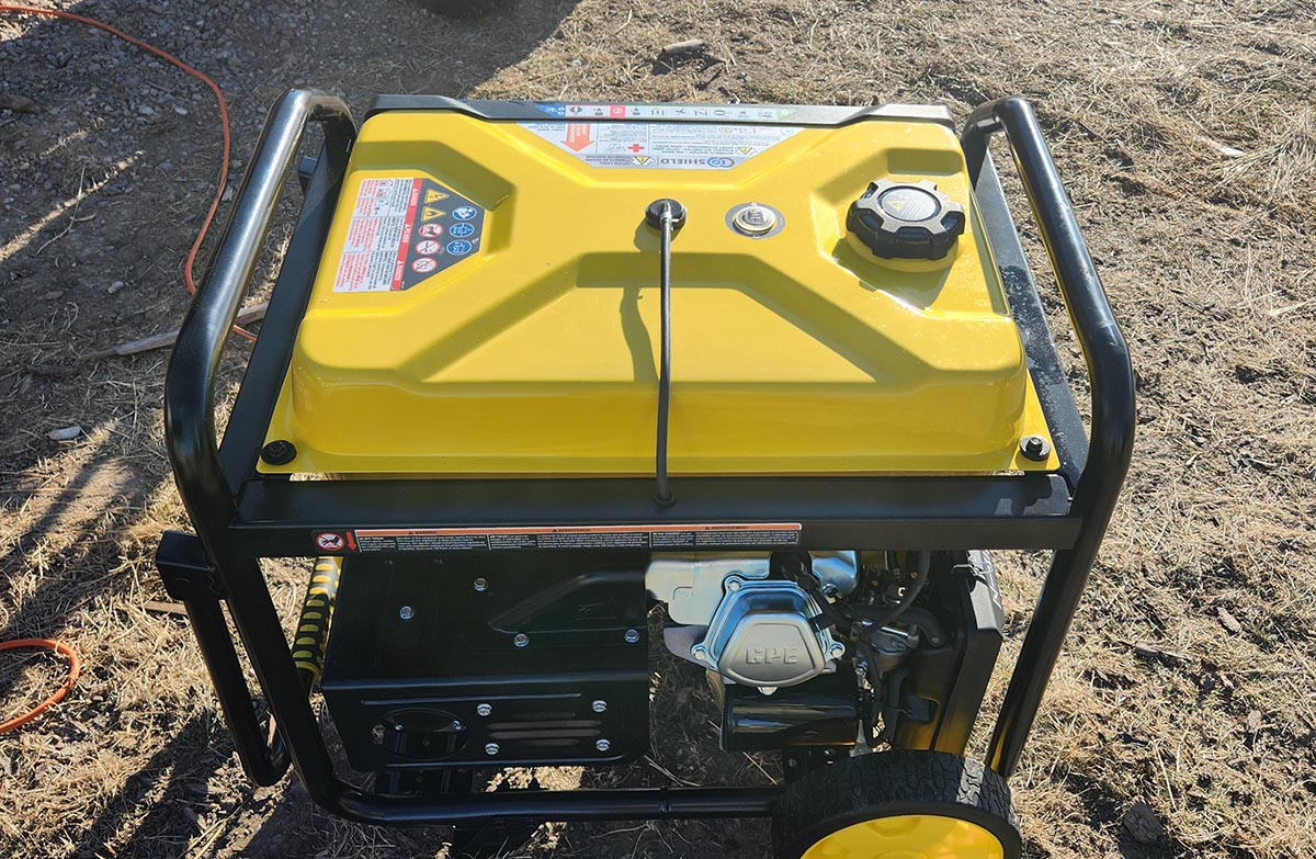 Top of Champion dual fuel generator with black cord coming out from the top