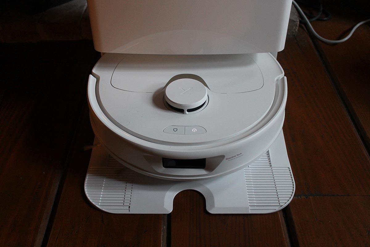 The Roborock Q Revo robot vacuum in its docking station during testing.