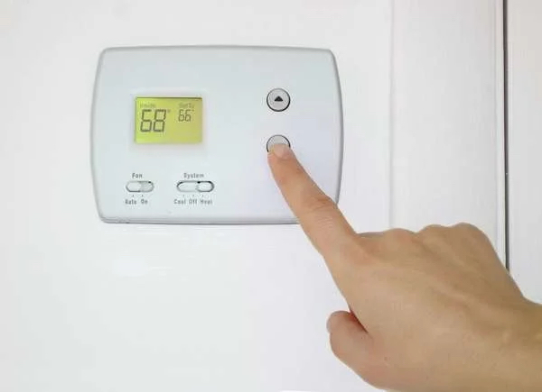 hand adjusting thermostat