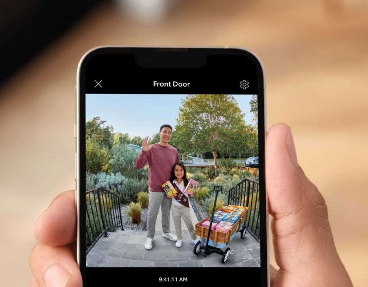 Smart phone video picture of father and daughter selling cookies.