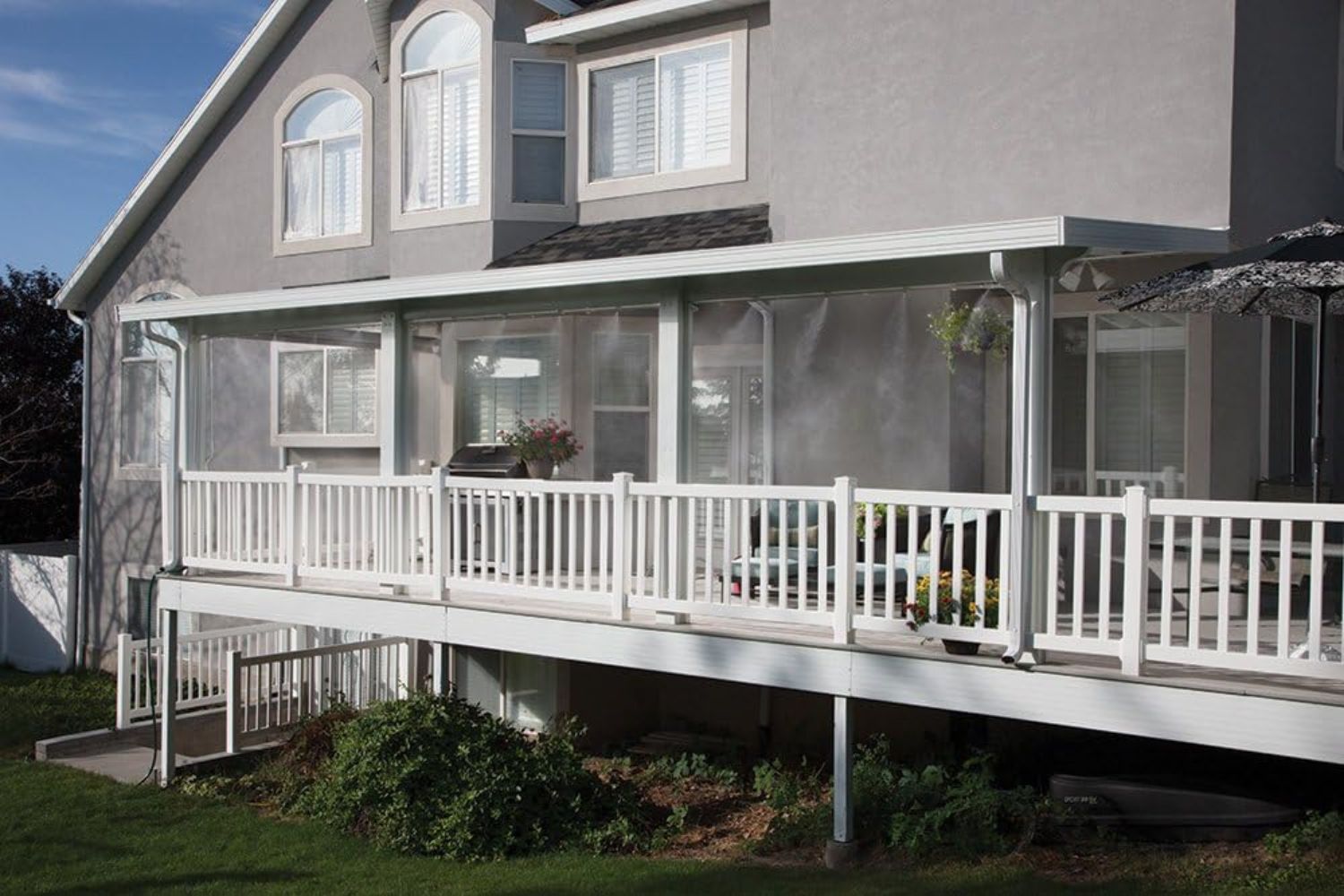 The Best Misting System installed along a front porch to keep the area cool.