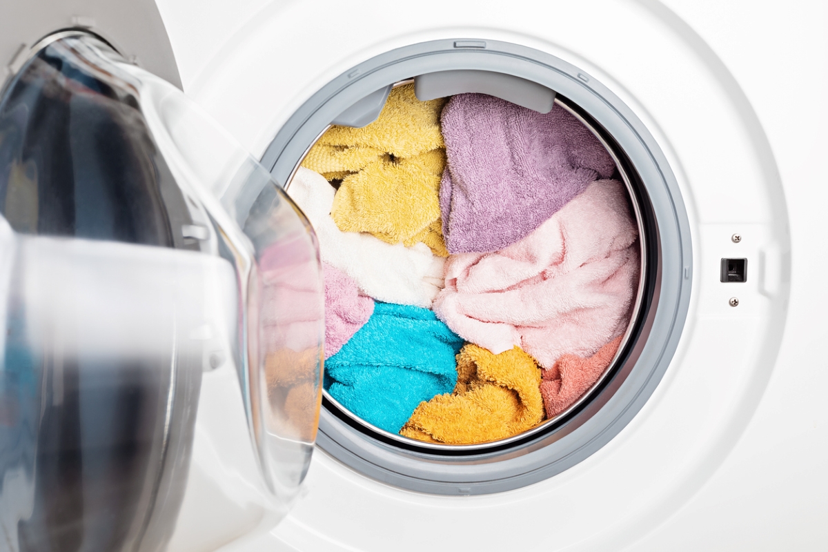 Colorful towels in washer.