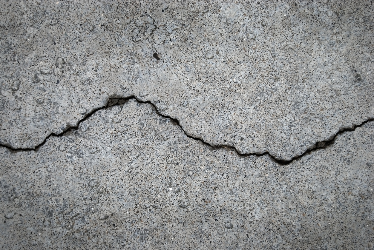 A crack runs across a cement floor