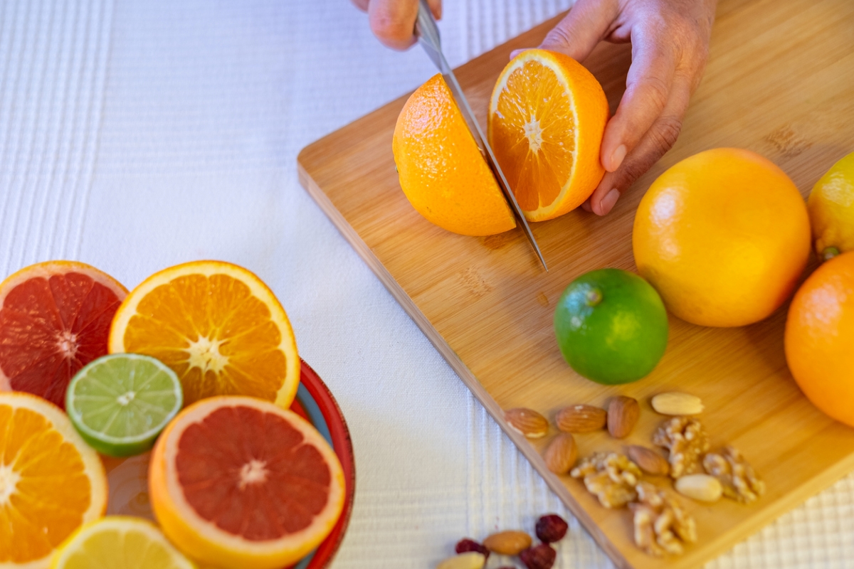 Person cutting fruit.