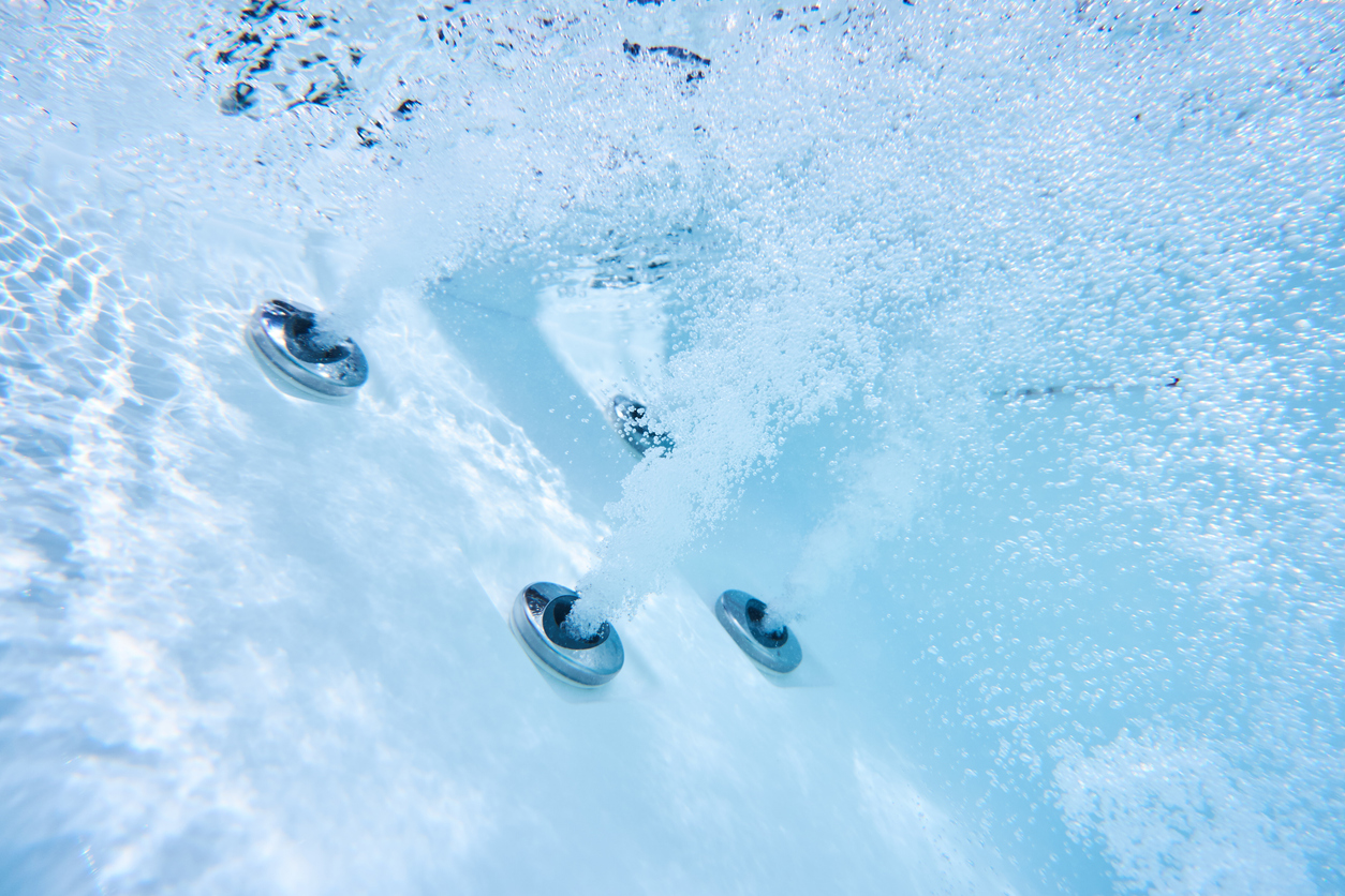 Water jutting from hot tub jets.