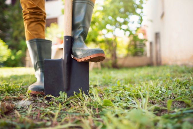 Gardener using shovel.