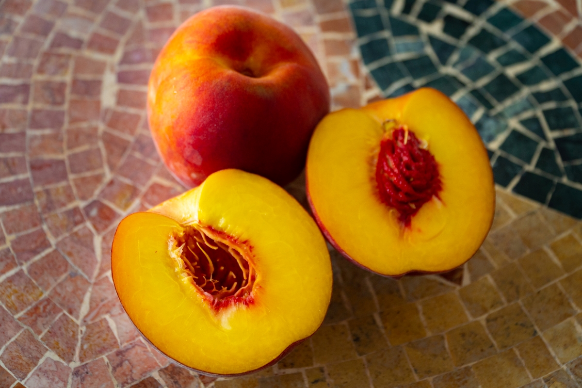 Nectarine with view of fruit pit.