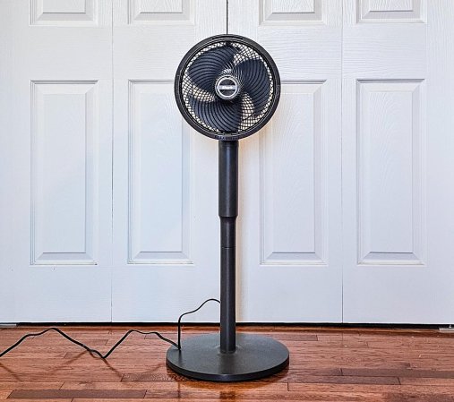 Shark FlexBreeze Fan with InstaCool set up in front of a set of closet doors.