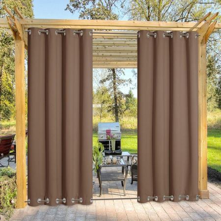  The Nicetown Double-Grommet Outdoor Curtain attached to the side of a pergola on an outdoor grilling area.