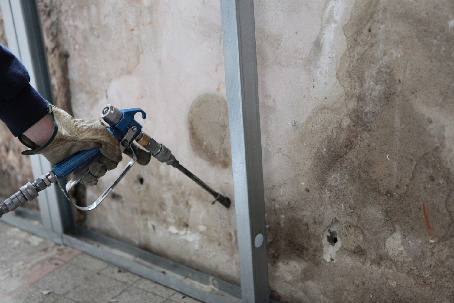 A close up of a garage wall being redone. 