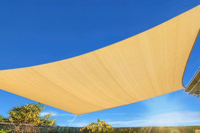  The Artpuch Rectangle Shade Sail with blue sky behind it.