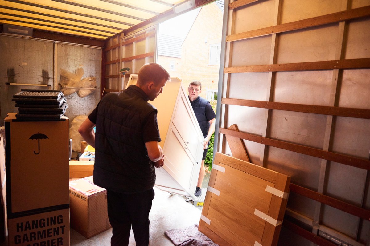 Moving company helping a family move out of their old home