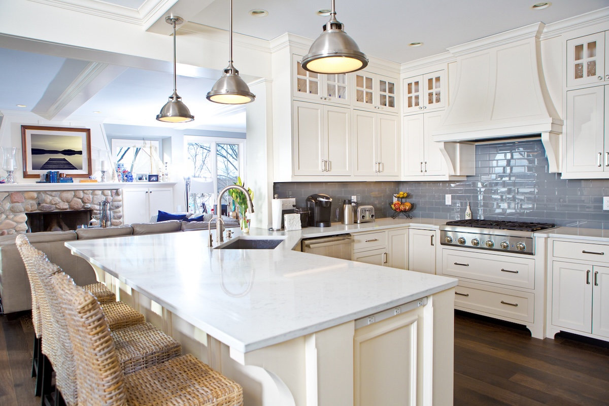 Open concept home with white kitchen.