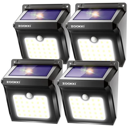  Four of the Zookki Solar Outdoor Lights on a white background.